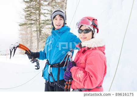 Men and women enjoying ice climbing Men and women enjoying ice climbing 89616175