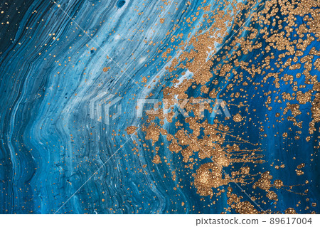 Fluid Art acrylic paints. Abstract mixing blue paint waves. Liquid golden flows splashes. Marble effect background or texture 89617004