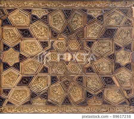 Ayyubid style panel with joined and carved wooden decorations of geometric and floral patterns 89617238