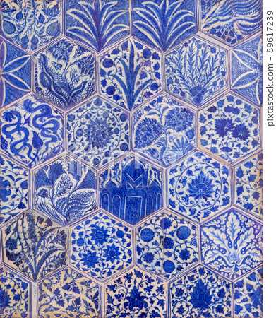 Ottoman era style glazed ceramic tiles decorated with floral ornamentations 89617239