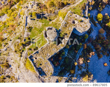 Collapsing tower of fortress Kosmac. Ancient Austro-Hungarian fortress built as a defensive structure and an observation post. Montenego Collapsing tower of fortress Kosmac. Ancient Austro-Hungarian fortress built as a defensive structure and an observation post. Montenego 89617805