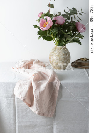 Elegant pink linen runner on the white tablecloth Elegant pink linen runner on the white tablecloth 89617833