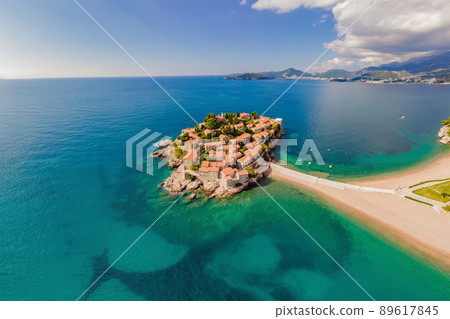 Aerophotography. View from flying drone. Panoramic view of Sveti Stefan island in Budva in a beautiful summer day, Montenegro. Top View. Beautiful destinations 89617845