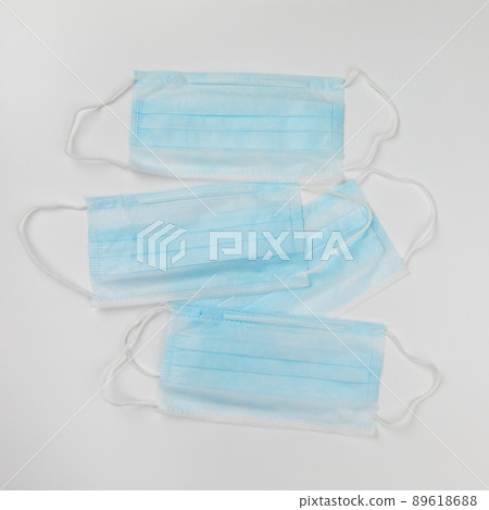blue surgical medical masks on white background 89618688