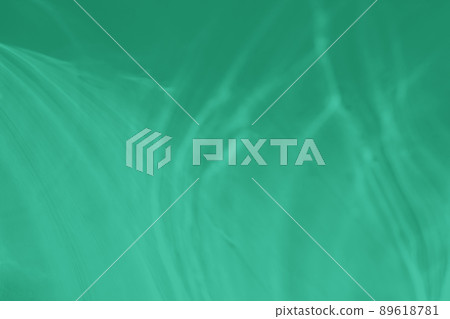mint colored abstract background with light and shadows caustic effect 89618781