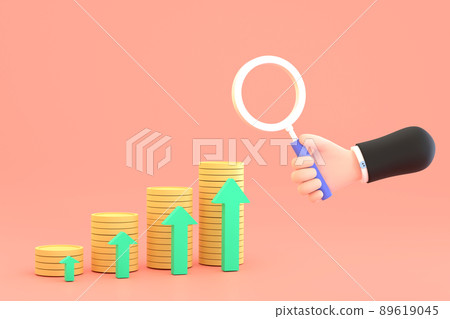 Magnifying glass on a pile of money coins. Stock Photo