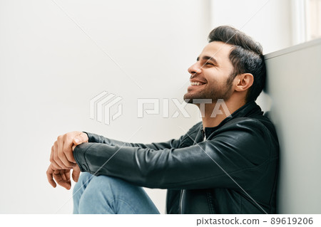 Portrait of happy smiling man posing on studio white background Portrait of happy smiling man posing on studio white background 89619206