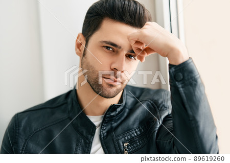Closeup portrait of handsome thoughtful man posing on white studio background 89619260