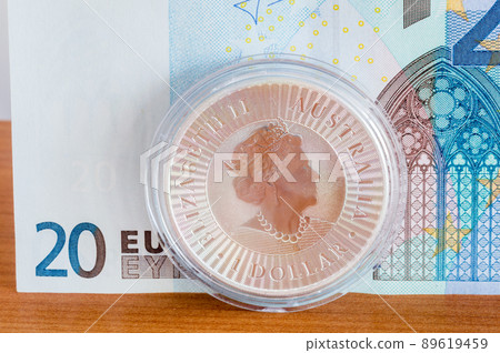 1 oz silver coin 1 Australian dollar Portrait of Queen Elizabeth II on 20 EURO banknote. 89619459