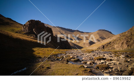 Sunset view to Tash-Rabat river and valley in Naryn province, Kyrgyzstan 89619982