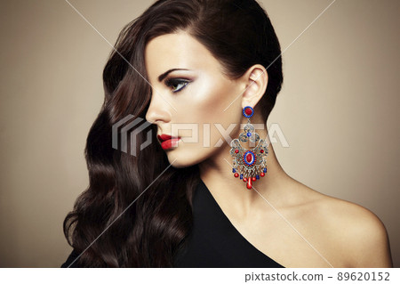 Portrait of beautiful brunette woman in black dress 89620152