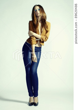 Fashion photo of young sensual woman in jeans 89620486