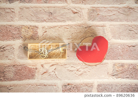 Bronze house key and red country fabric heart old wood, Valentines Day. Bronze house key and red country fabric heart old wood, Valentines Day. 89620636