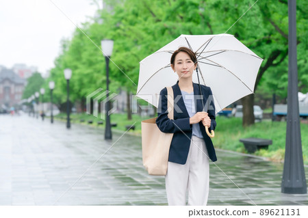 Business woman rain umbrella rainy season 89621131