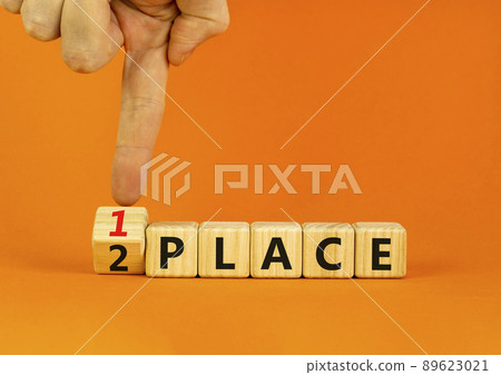 From 2 to 1 place symbol. Businessman turns wooden cubes and changes concept words 2 place to 1 place. Beautiful orange table orange background. Business and from 2 to 1 place concept. Copy space. From 2 to 1 place symbol. Businessman turns wooden cubes and changes concept words 2 place to 1 place. Beautiful orange table orange background. Business and from 2 to 1 place concept. Copy space. 89623021