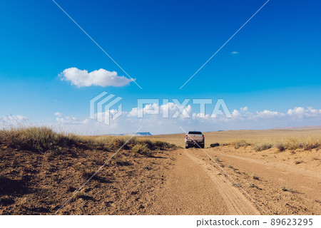 Vehicle driving on rural road in summer Vehicle driving on rural road in summer 89623295