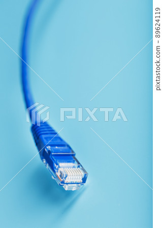Blue Ethernet Cable Cord Patch cord on a blue background with free space 89624119