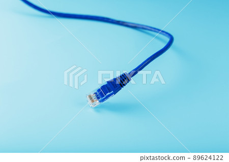 Blue Ethernet Cable Cord Patch cord on a blue background with free space 89624122