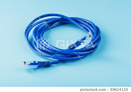 Blue Ethernet Cable Cord Patch cord on a blue background with free space 89624128