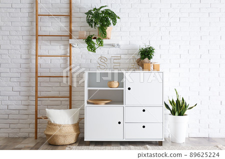 Chest of drawers in stylish room interior Chest of drawers in stylish room interior 89625224