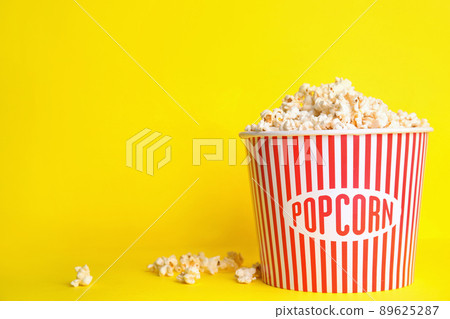 Tasty pop corn on yellow background. Space for text Tasty pop corn on yellow background. Space for text 89625287