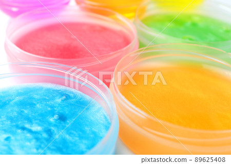 Colorful slimes in plastic containers, closeup. Antistress toy Colorful slimes in plastic containers, closeup. Antistress toy 89625408