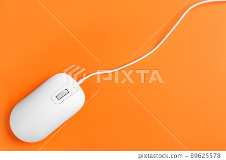 Modern wired optical mouse on orange background, top view Modern wired optical mouse on orange background, top view 89625578