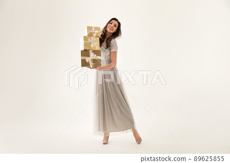 Beautiful woman with Christmas gifts on white background Beautiful woman with Christmas gifts on white background 89625855