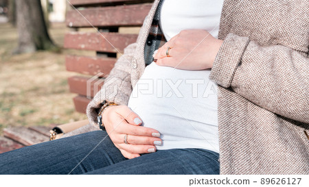 Healthy Pregnancy woman. Happy maternity mother in summer park. Baby belly. Pregnant walking nature. Concept of pregnancy, maternity, expectation. Healthy Pregnancy woman. Happy maternity mother in summer park. Baby belly. Pregnant walking nature. Concept of pregnancy, maternity, expectation. 89626127