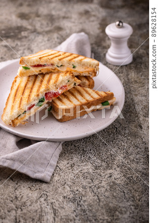 Grilled homemade sandwiches with cheese 89628154
