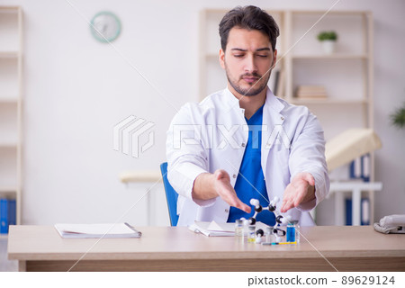 Young male doctor in vaccination concept Young male doctor in vaccination concept 89629124