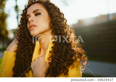 close-up. The girl's face is very beautiful which closing her eyes in a trance state touches the neck with her hand close-up. The girl's face is very beautiful which closing her eyes in a trance state touches the neck with her hand 89629437