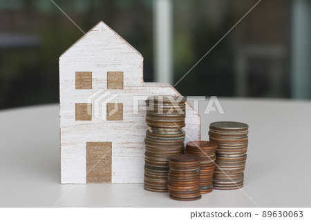 Miniature house and stacked coins 2 Miniature house and stacked coins 2 89630063