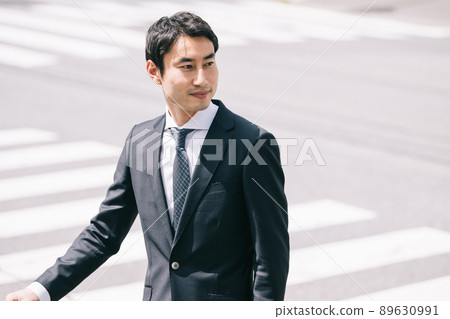 Male businessman in a suit / business trip Male businessman in a suit / business trip 89630991