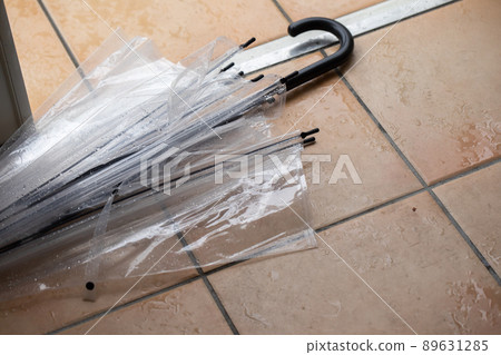 Umbrella randomly placed at the entrance 89631285