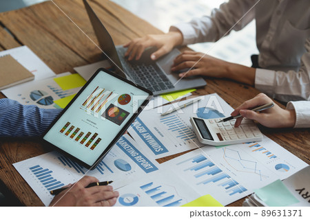 Business People Meeting to discuss and brainstorming the financial report paperwork in home office. Financial advisor teamwork and accounting concept. 89631371