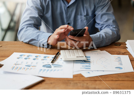 A businessman completes KYC using an online banking program in order to open a digital savings account. The definition of cyber security. 89631375