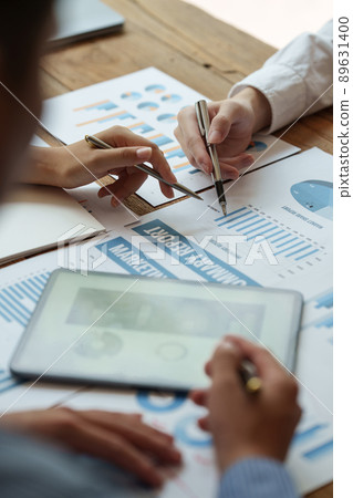 Fund managers team consultation and discuss about analysis Investment stock market by digital tablet. Fund managers team consultation and discuss about analysis Investment stock market by digital tablet. 89631400