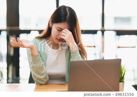 Frustrated young woman have problem while sitting at her working place. Business Stressed concept. 89631550