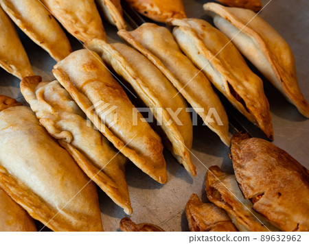 Rows of fresh, just baked empanadas 89632962