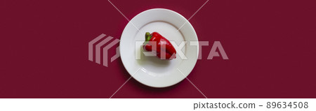 Red bell pepper on white plate on the red background. Red bell pepper on white plate on the red background. 89634508