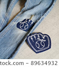 Repair denim pants with vintage appliqué 89634932