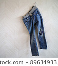 Repair denim pants with vintage appliqué 89634933
