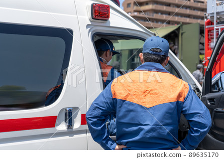 Back view of ambulance and rescuer 89635170