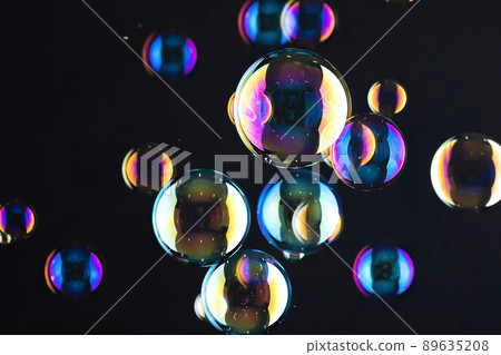 Soap bubble that shines on a gray background 89635208