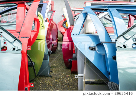 dismantling of a car into spare parts at a junkyard dismantling of a car into spare parts at a junkyard 89635416