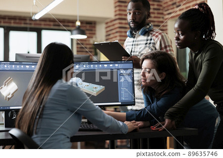 Diverse digital artists working together using advanced specialized software to improve mesh geometry. Multiethnic employees brainstorming together to find solutions in order to optimise 3D scene. Diverse digital artists working together using advanced specialized software to improve mesh geometry. Multiethnic employees brainstorming together to find solutions in order to optimise 3D scene. 89635746