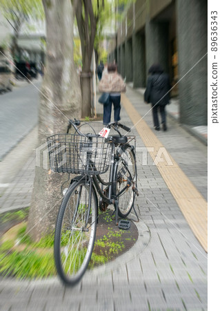 Illegal parked bicycle with a bicycle parking prohibition card affixed Illegal parked bicycle with a bicycle parking prohibition card affixed 89636343