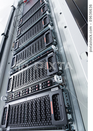 Row of hard drives serving as data storage inside server room Row of hard drives serving as data storage inside server room 89636636