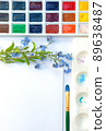 Flat lay sketchbook, watercolor brushes and color palette 89638487